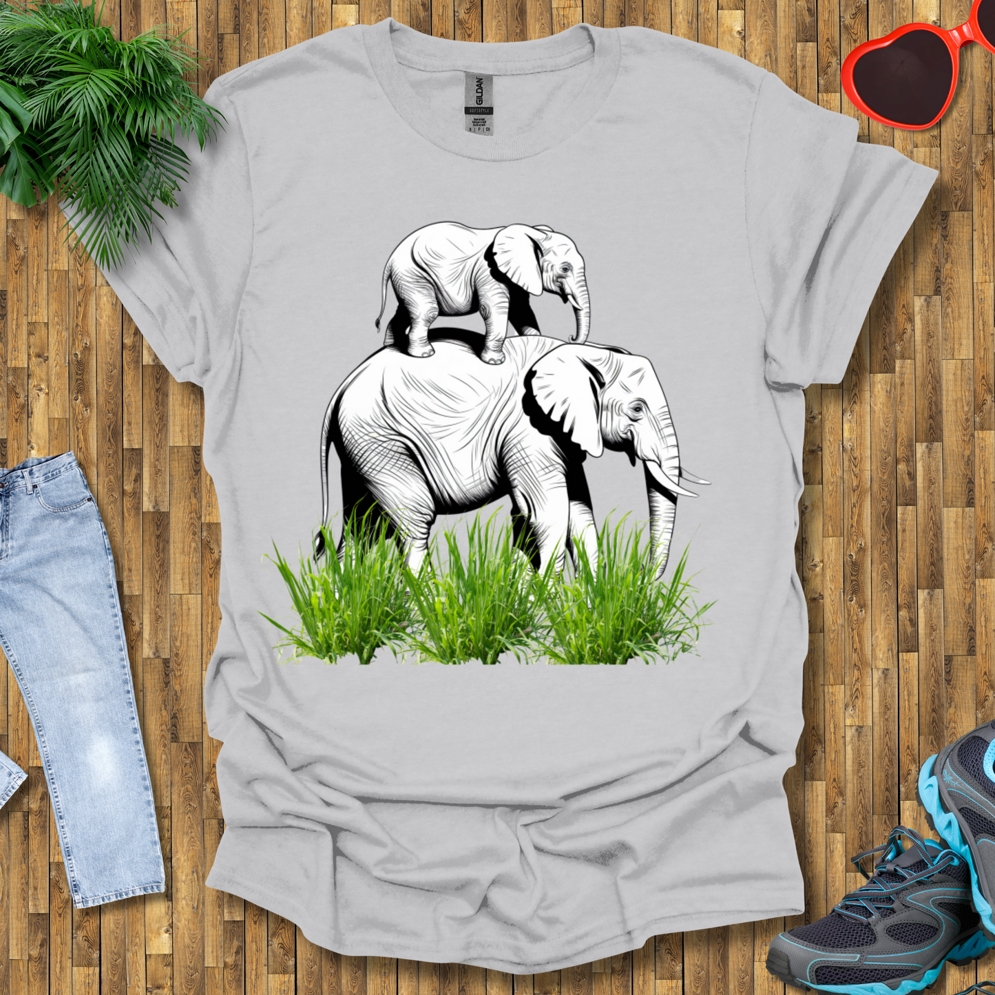 Mother elephant carrying baby elephant T-Shirt