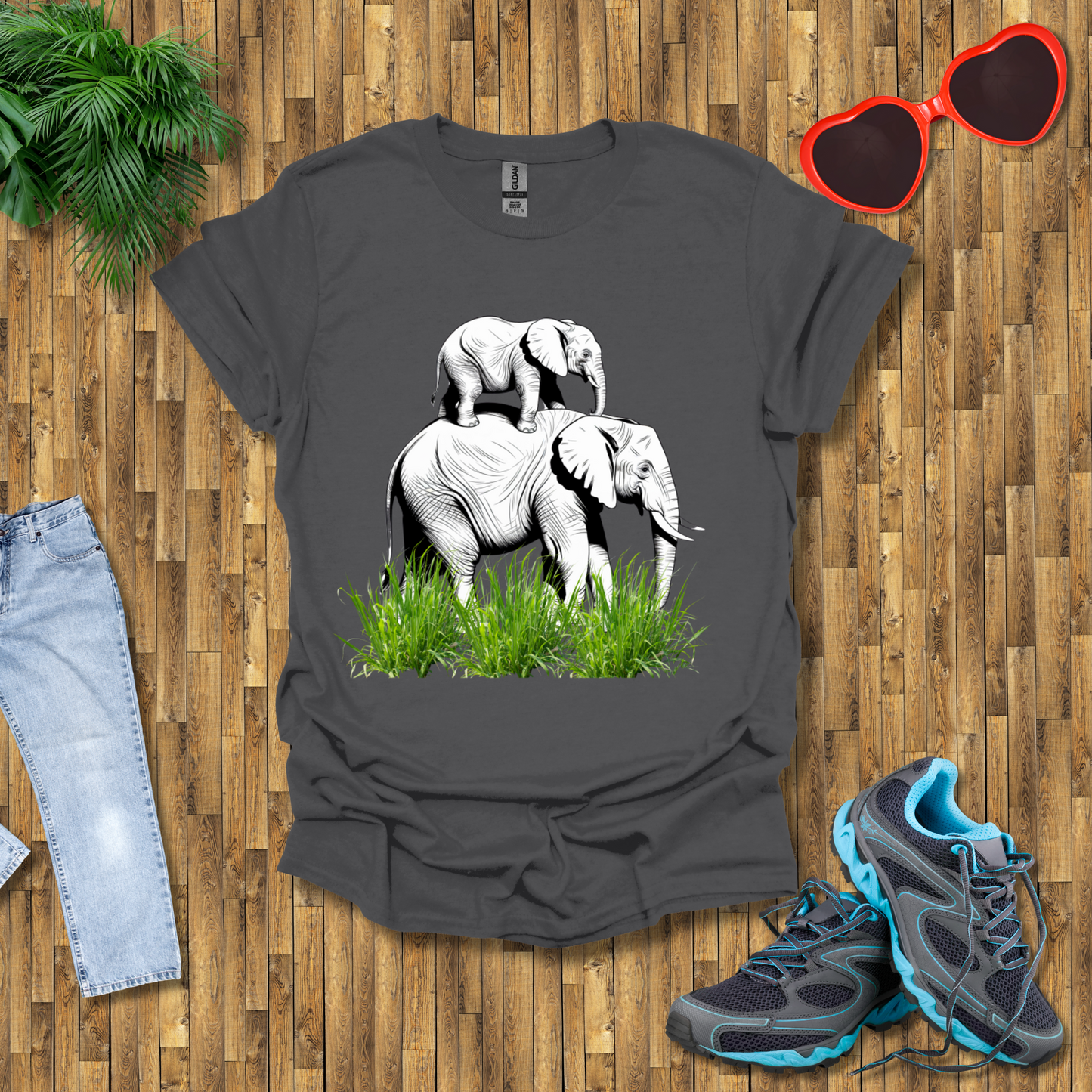 Mother elephant carrying baby elephant T-Shirt