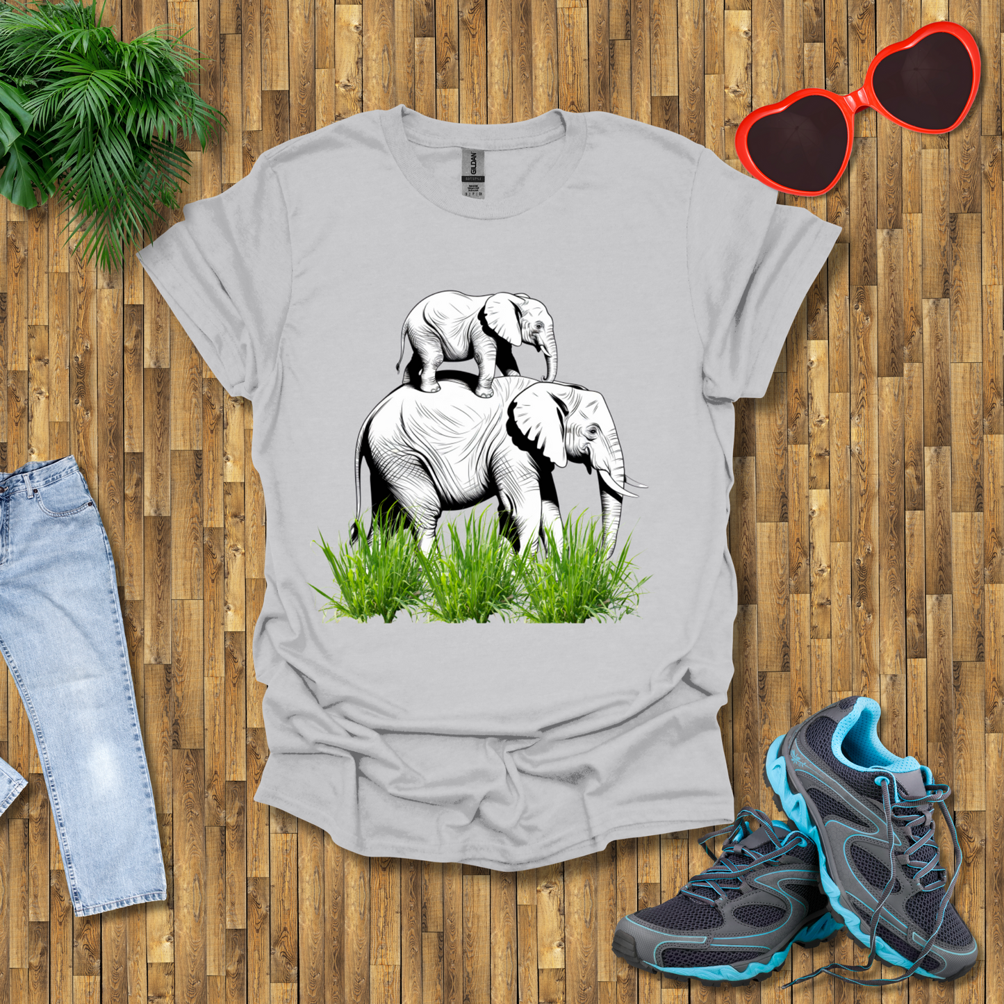 Mother elephant carrying baby elephant T-Shirt