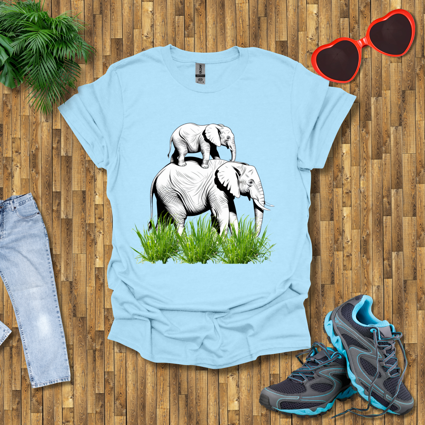 Mother elephant carrying baby elephant T-Shirt