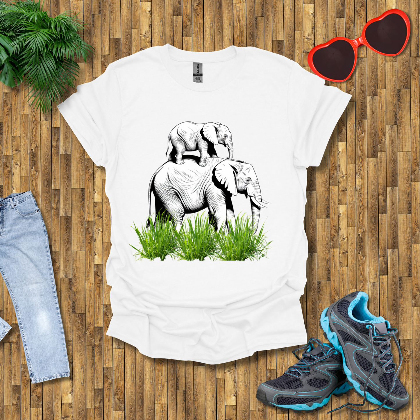 Mother elephant carrying baby elephant T-Shirt